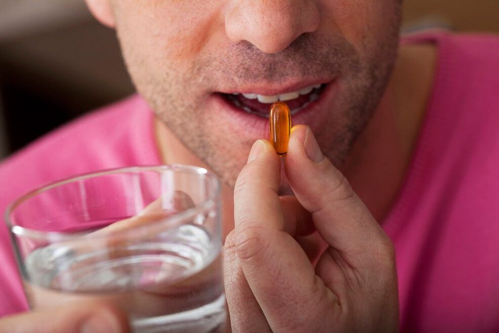 a man drinks vitamins to improve the functioning of the nervous system